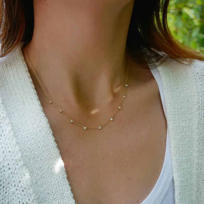 Single EF Collection 9 Prong Set Diamond Necklace in yellow gold on models neck