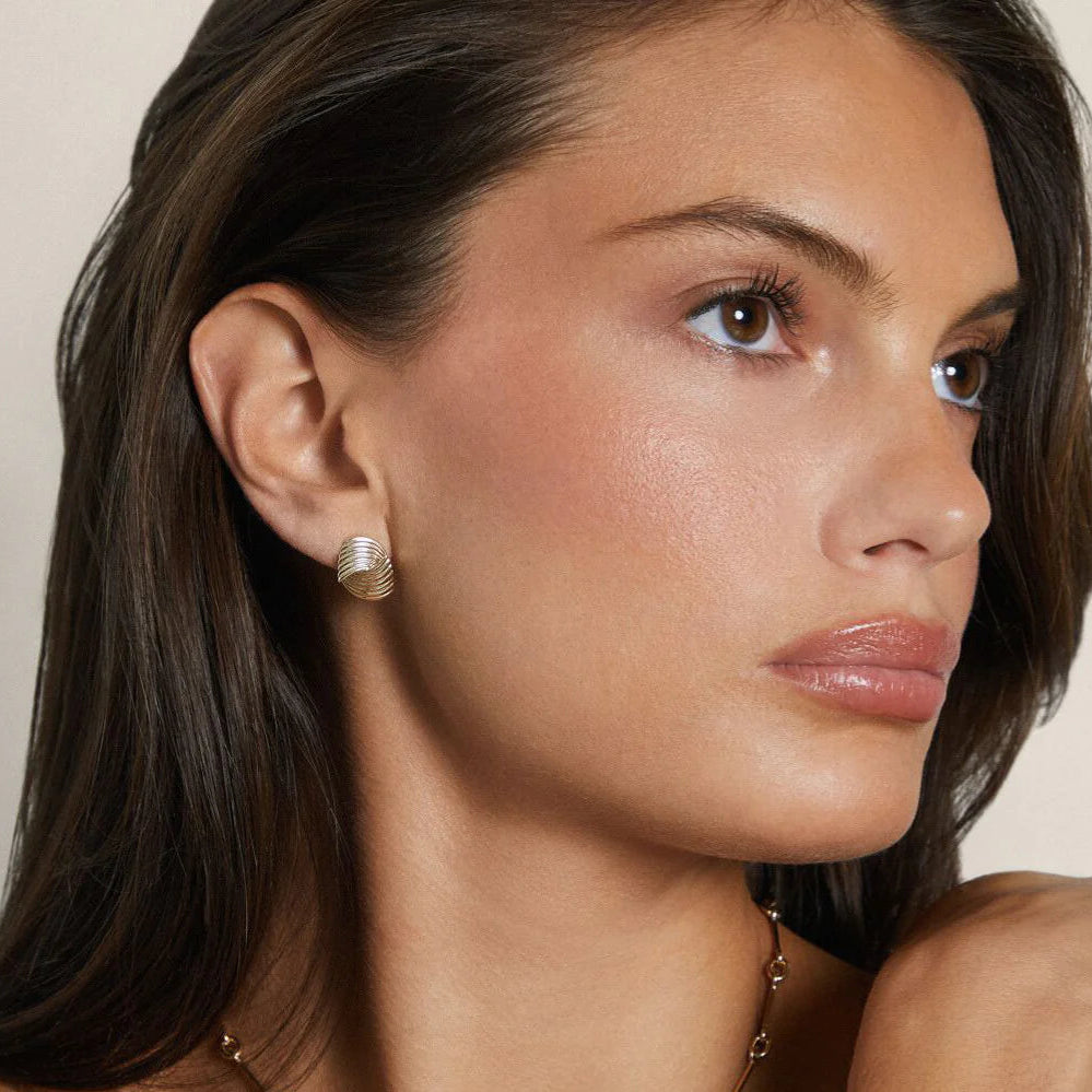 image of EF-Collection Gold Freya Stud Earrings in yellow gold on a model's ear.