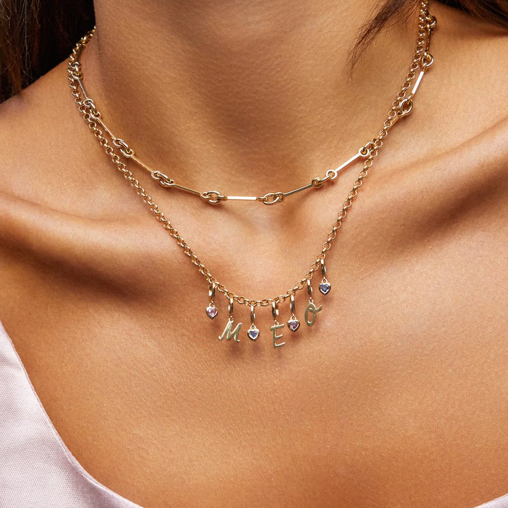 image of EF-Collection Mini Blue Sapphire Heart Clip Charm in rose gold clipped onto a chain necklace on a model's neck.