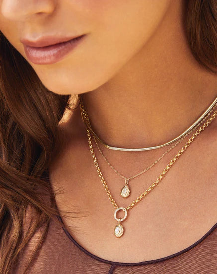 Close up of Ef Collection Snake chain necklace in yellow gold on a white background.