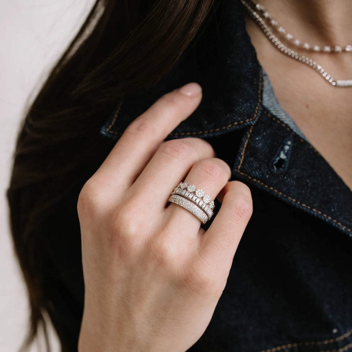 Dana Rebecca Designs Taylor Beth Eternity Band Ring in white gold stacked on models finger with diamond band