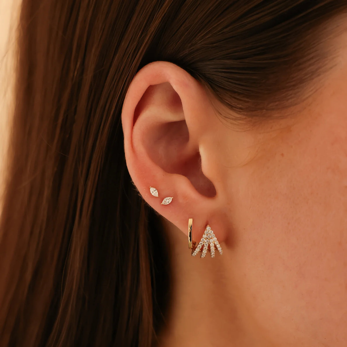 Dana Rebecca Designs Alexa Jordyn Marquise Diamond Single Stud Earring in yellow gold on models ear layered with two different huggies