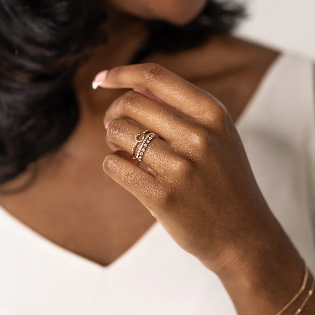 Dana Rebecca Designs Ava Bea Double Row Ring in yellow gold styled on models hand with initial ring