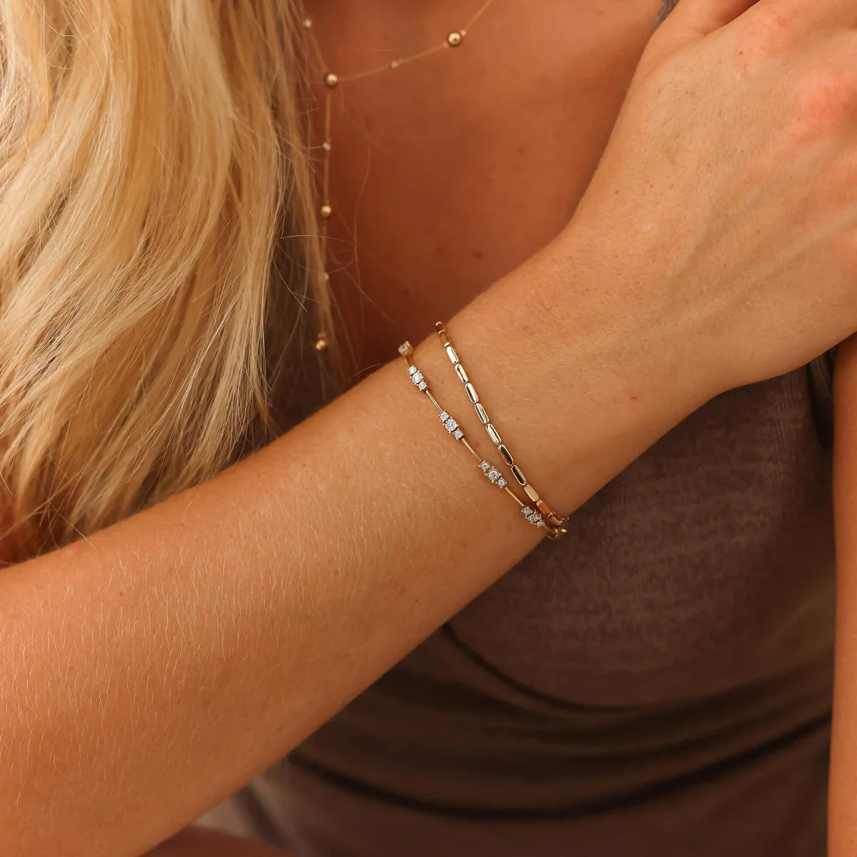 Dana Rebecca Designs Ava Bea Spaced tennis bracelet in yellow gold and diamonds close up on model