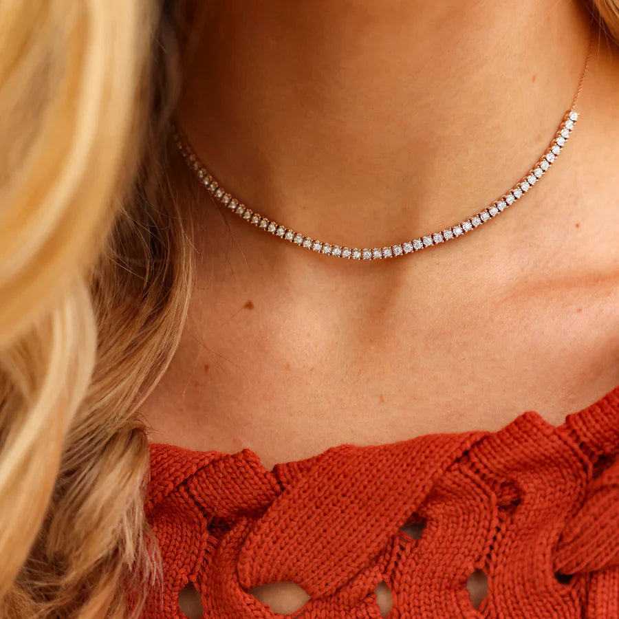 Single Dana Rebecca Designs Ava Bea Tennis Necklace in yellow gold on models neck wearing a red blouse