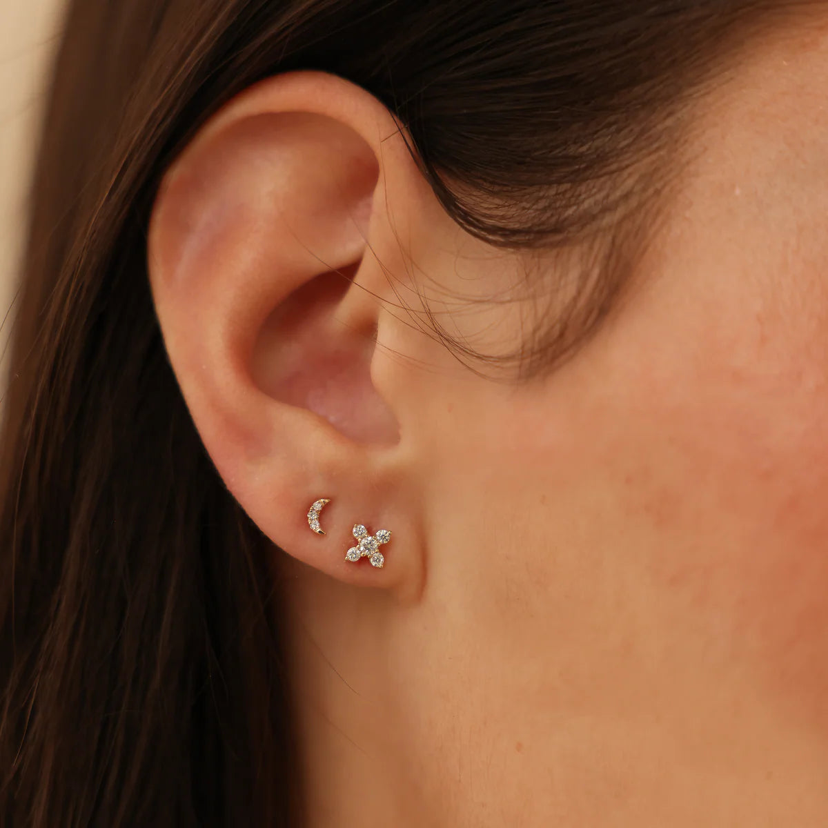 close up of Ava Bea X Studs in White Gold stacked with moon studs.