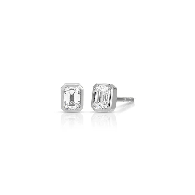 Ef collection Bezel Set Emerald Cut Diamond Stud Earring in white gold on white background.