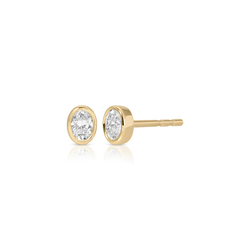 EF Collection Bezel Set Oval Diamond Stud Earrings in yellow gold displayed on white background.