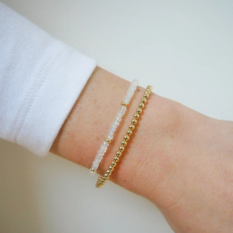 EF-Collection Birthstone Bead Bracelet In Moonstone in yellow gold styled on models wrist with yellow gold bead bracelet