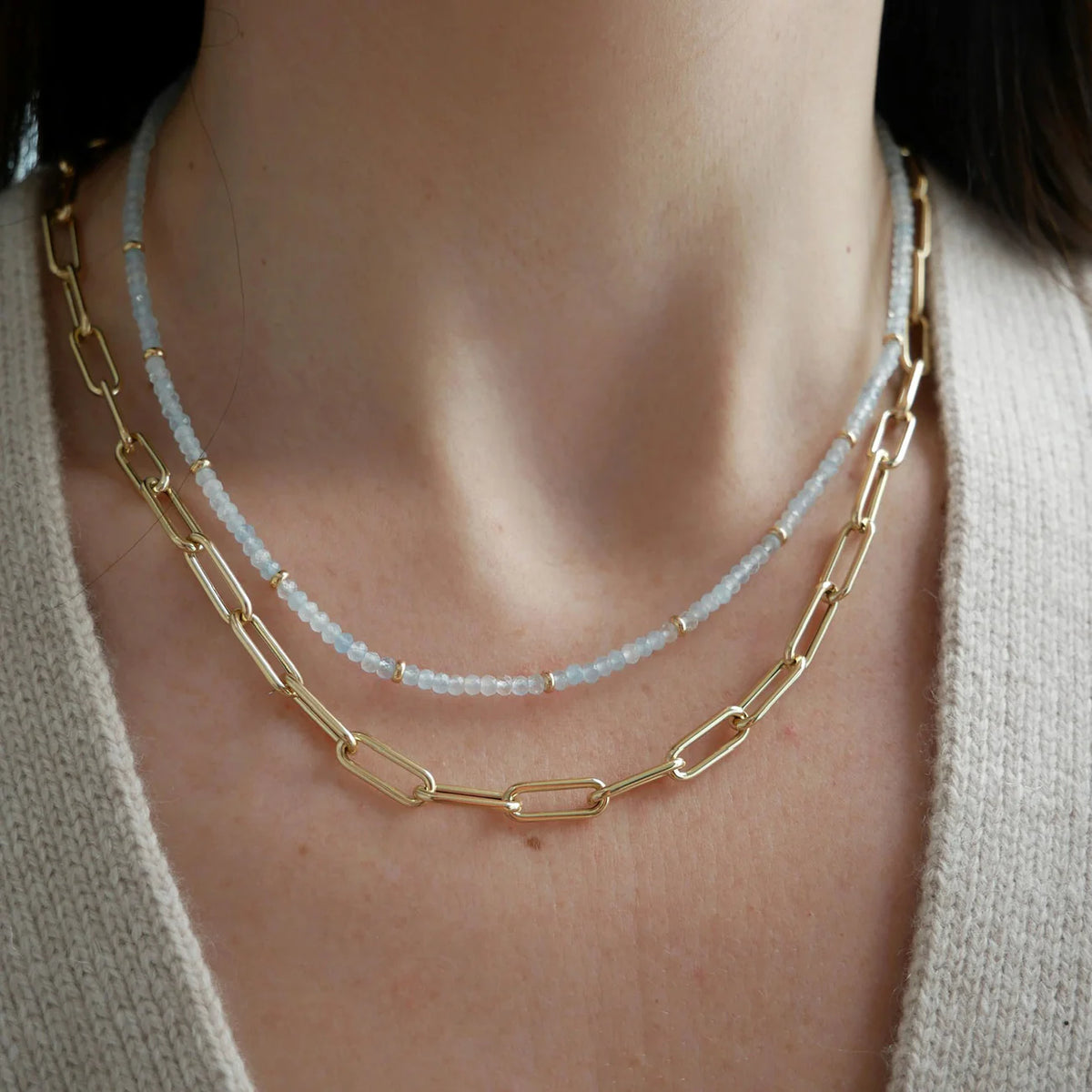 EF-Collection Birthstone Bead Necklace In Aquamarine in yellow gold styled on models neck with jumbo chain necklace