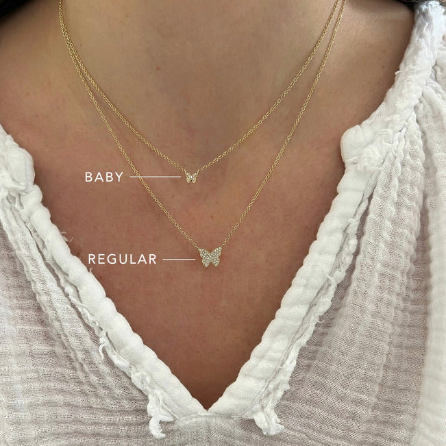 EF Collection Diamond Baby Butterfly Necklace in yellow gold comparing sizes with the regular butterfly necklace