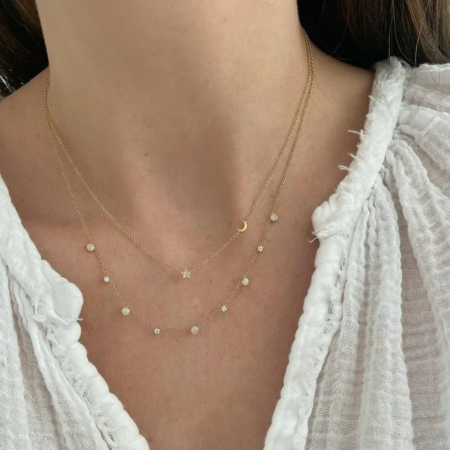 EF Collection Diamond Baby Star & Gold Moon Necklace in yellow gold styled on models neck.