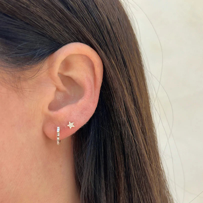 EF Collection Diamond Baby Star Stud Earring in yellow gold styled on models ear with a diamond huggie.