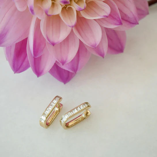 EF-Collection Diamond Baguette Jumbo Lola Hoop Earring in yellow gold on white background with flower