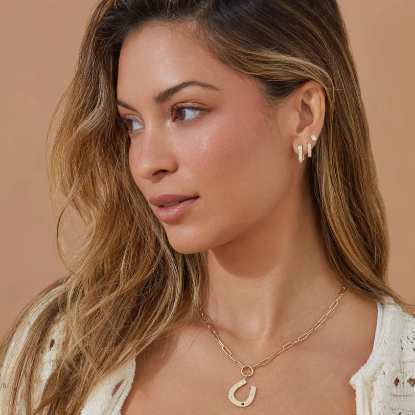 Ef collection Diamond Baguette Jumbo Lola Huggie Earring styled on model.