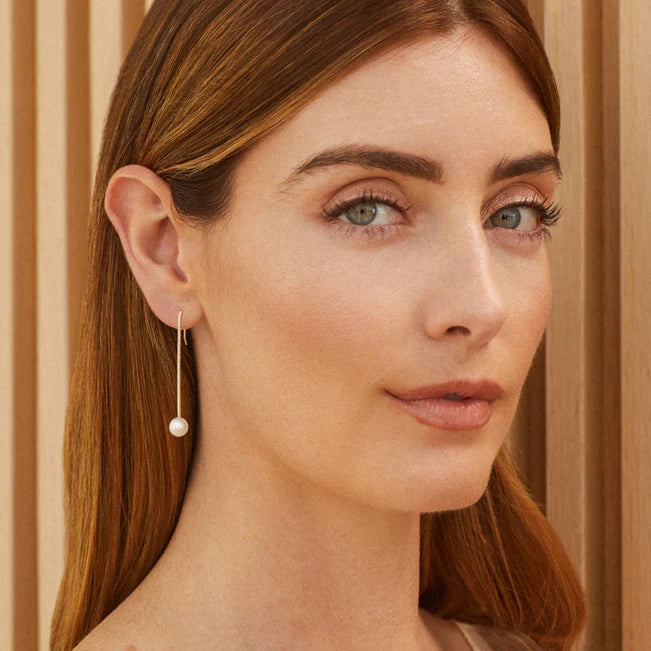 EF Collection DIamond Bar Pearl Drop Earring in yellow gold on models ear.
