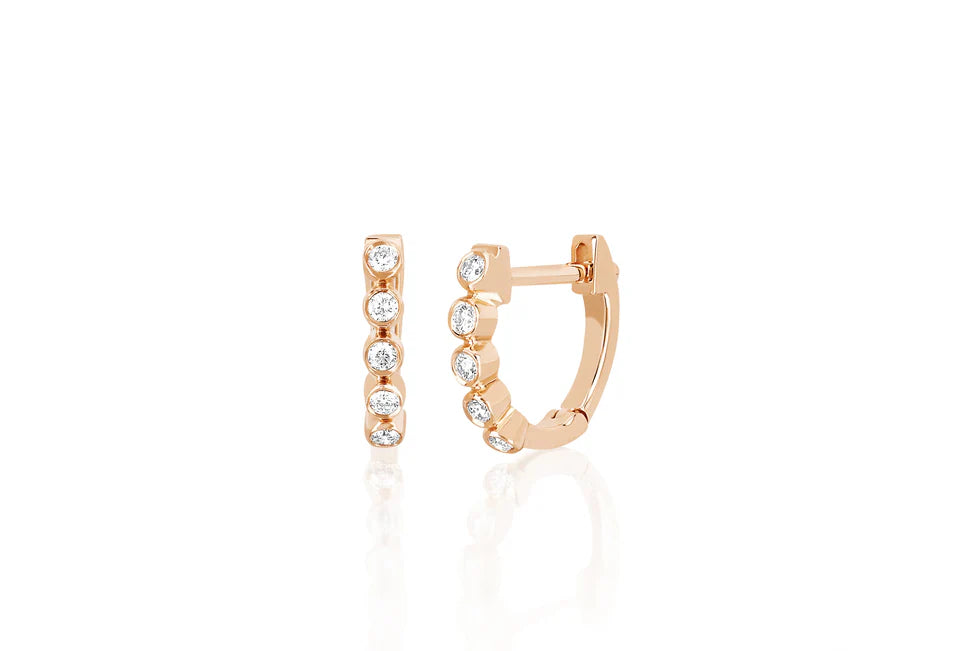 EF Collection Diamond Bezel Mini Huggie Earring in rose gold on white background.