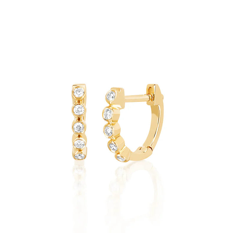 EF Collection Diamond Bezel Mini Huggie Earring in yellow gold on white background.