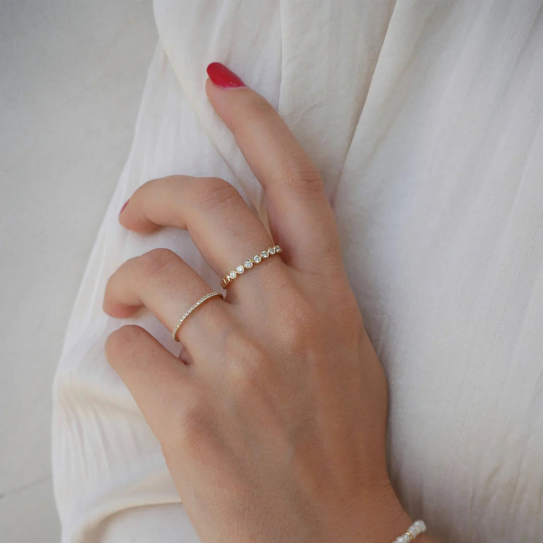 EF-Collection Diamond Bezel Stack Band Ring in yellow gold styled on models finger wearing a white shirt