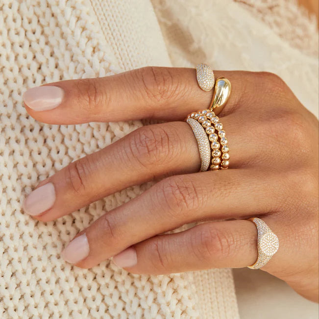 Close up of EF-Collection Diamond & Gold Jumbo Double Dome Ring in yellow gold on models finger