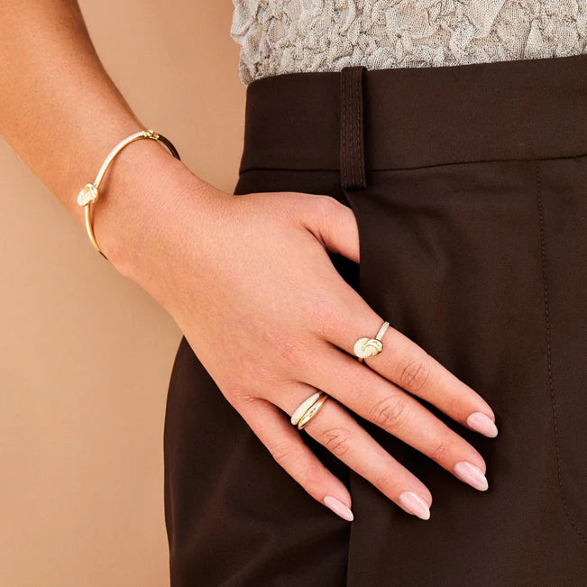 EF Collection Diamond & Gold Jumbo Love Knot Ring in yellow gold on model’s finger.