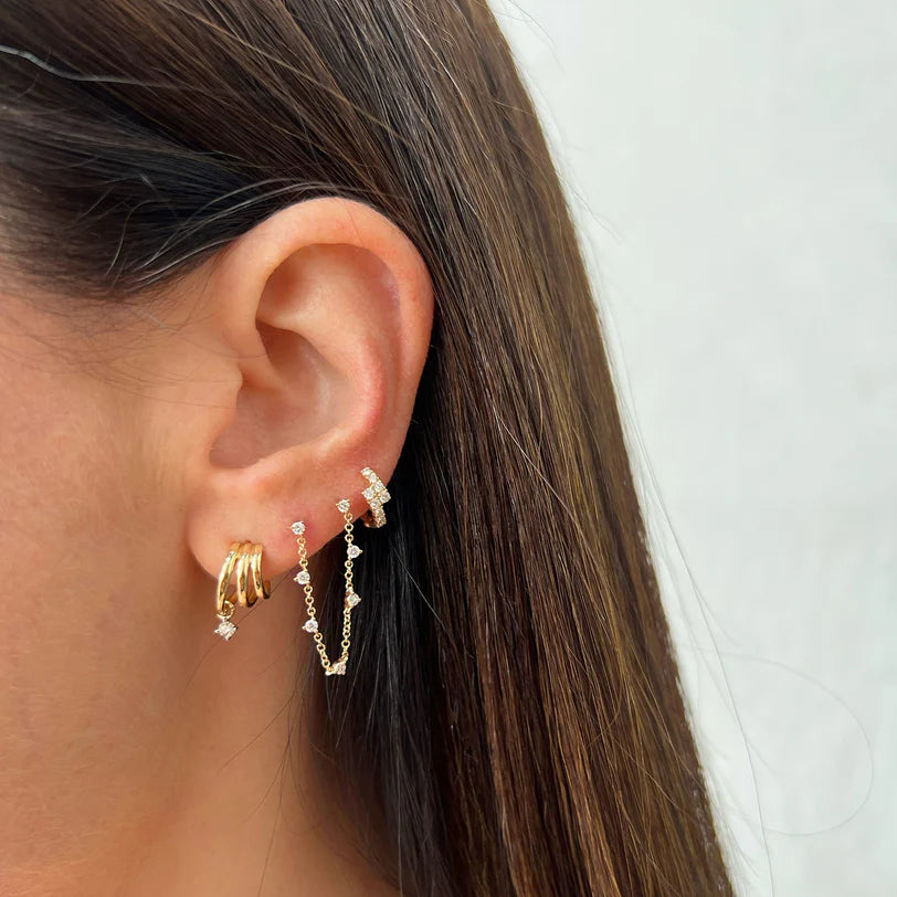 Single EF Collection Diamond Marley Mini Huggie Earring in yellow gold on models ear