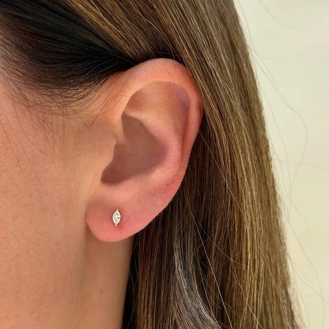 Single EF Collection Diamond Marquise Stud Earring in yellow gold models ear.