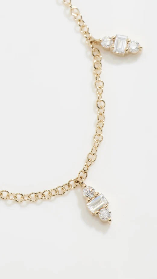 Close up of EF Collection Diamond Mia Necklace in yellow gold on white background.