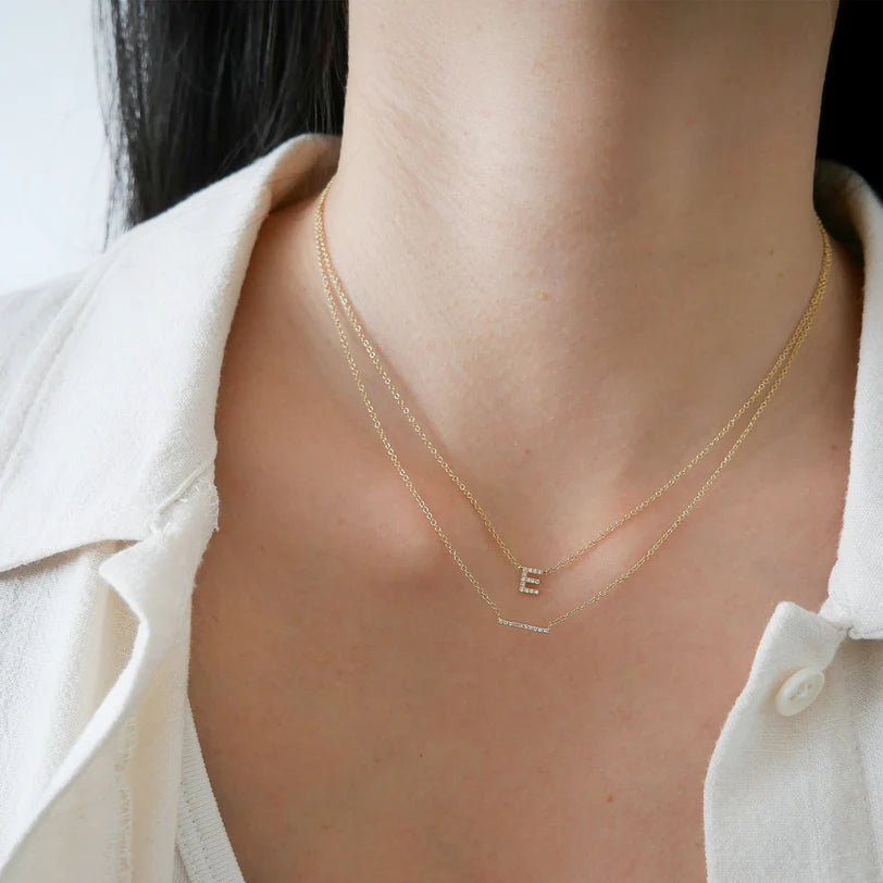 EF Collection Diamond Mini Bar Necklace in yellow gold styled on models neck.