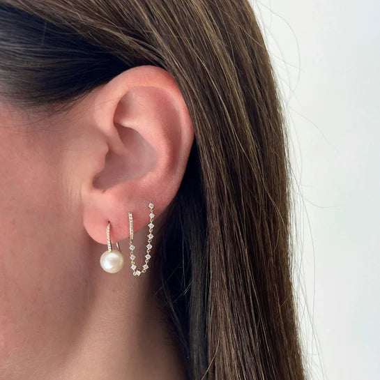 EF-Collection Diamond Mini Huggie & Prong Set Chain Stud Earrings in yellow styled on models ear with pearl earring