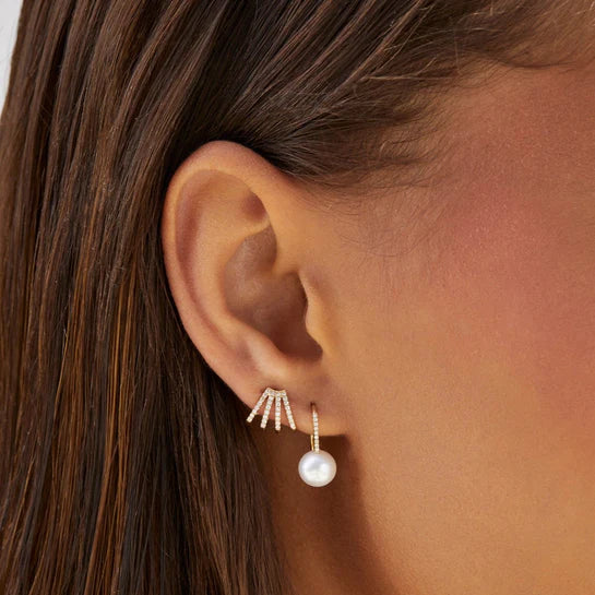 EF-Collection Diamond Multi Huggie Earrings in yellow gold on models ear with diamond and pearl earring