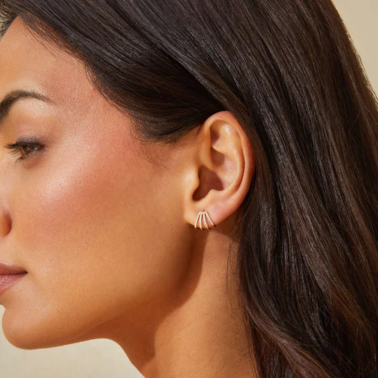 Single EF-Collection Diamond Multi Huggie Earrings in yellow gold styled on models ear