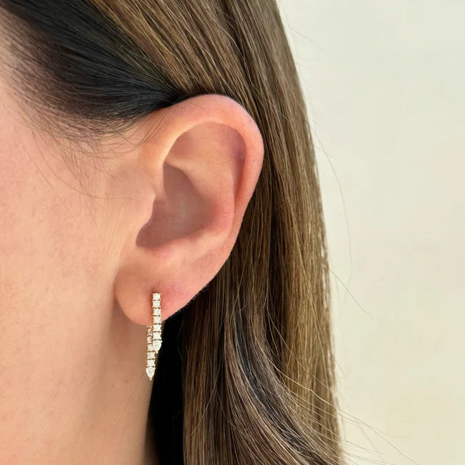 Close up of EF-Collection Diamond Teardrop Fringe Earring on models ear with a neutral background