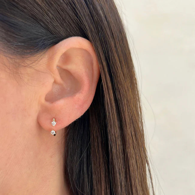EF Collection Double Prong Set Diamond Earring in yellow gold styled on models ear.