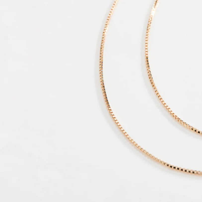 Close up of EF-Collection Double Strand Liquid Gold Necklace in yellow gold on white background