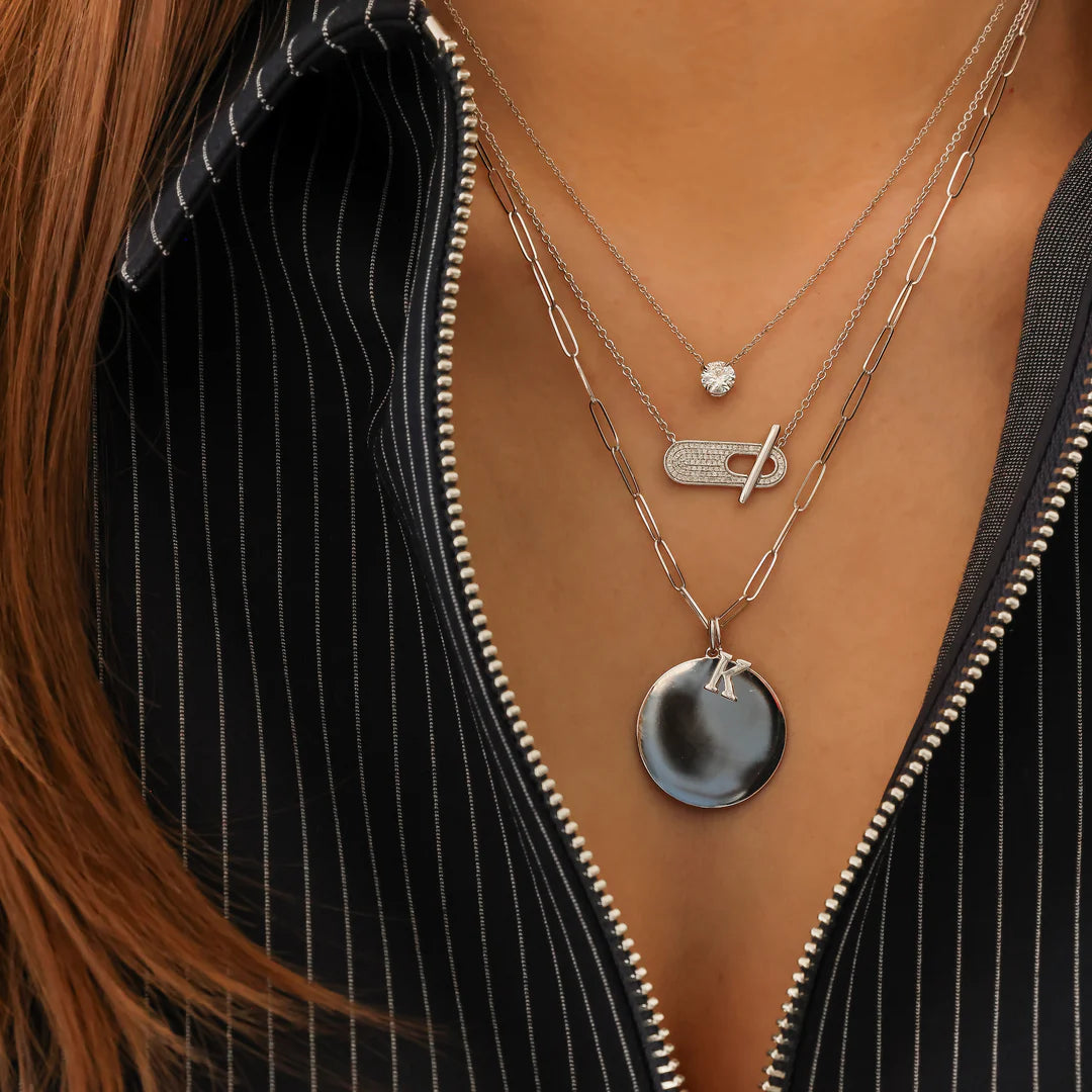 Dana Rebecca Designs DRD Gold Initial Charm in white gold on models neck with diamond toggle necklace