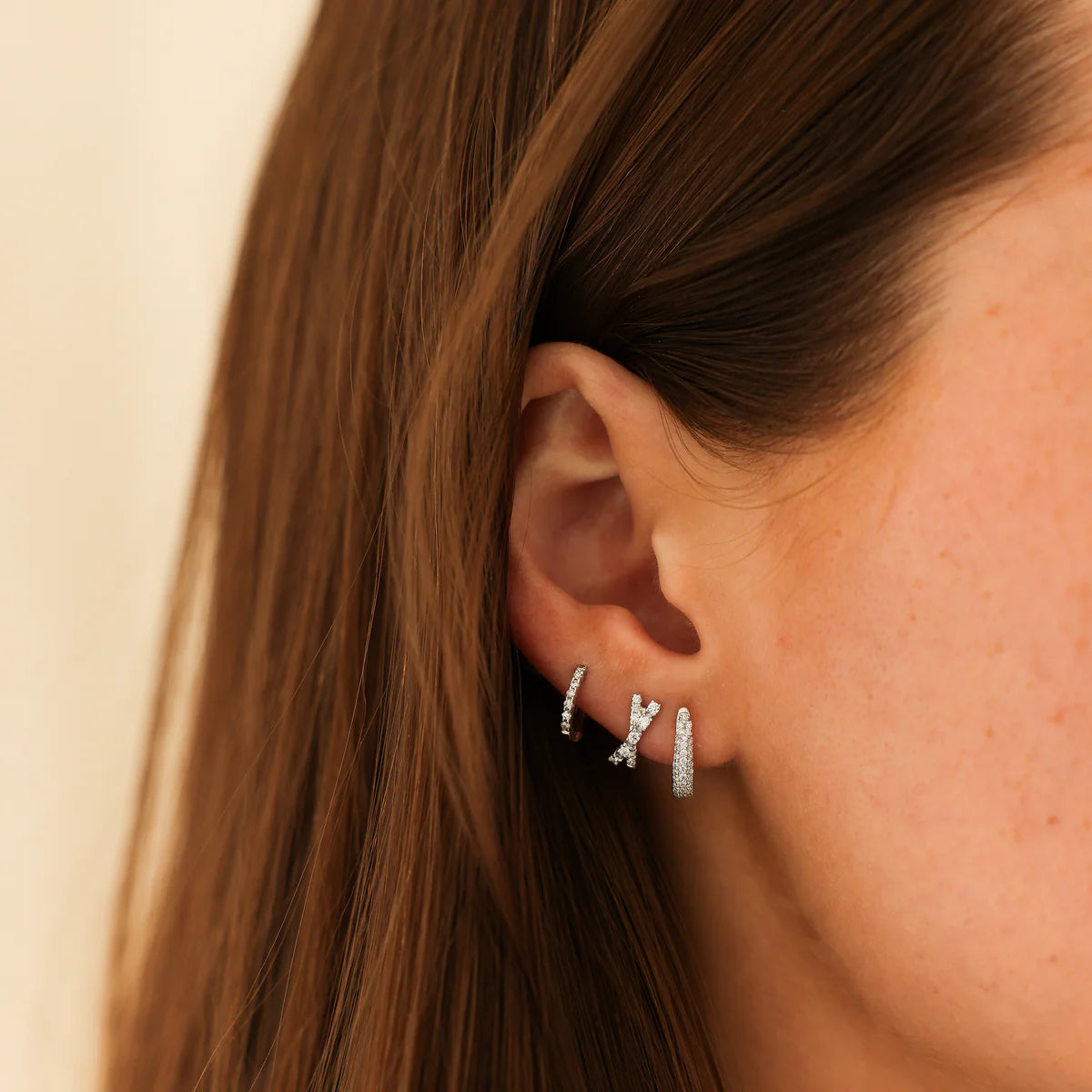 White Gold Diamond Huggie Earrings: DRD Tapered Huggies In White Gold