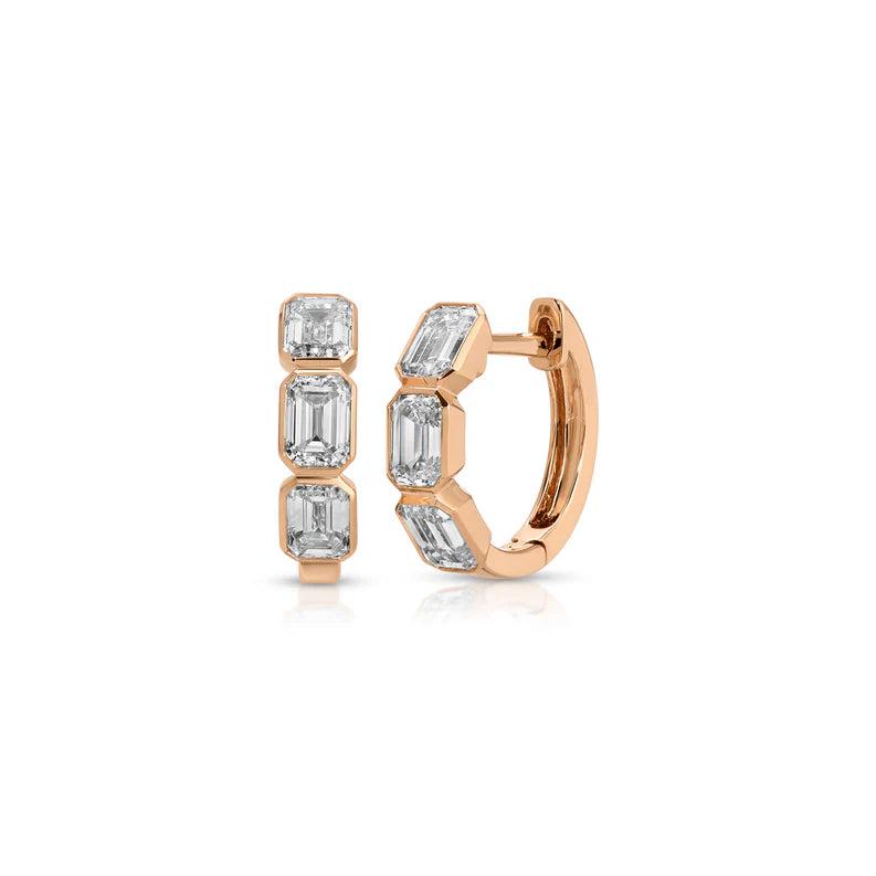 Emerald Cut Diamond Bezel Mini Huggie Earrings in rose gold displayed on a white background.