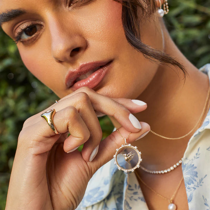 Single EF Collection Floating Hummingbird Necklace in yellow gold on models neck