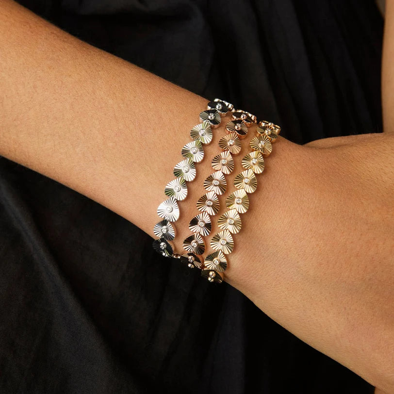 EF Collection Gold & Diamond Fluted Heart Eternity Bracelet in yellow, white, and rose gold on models wrist.