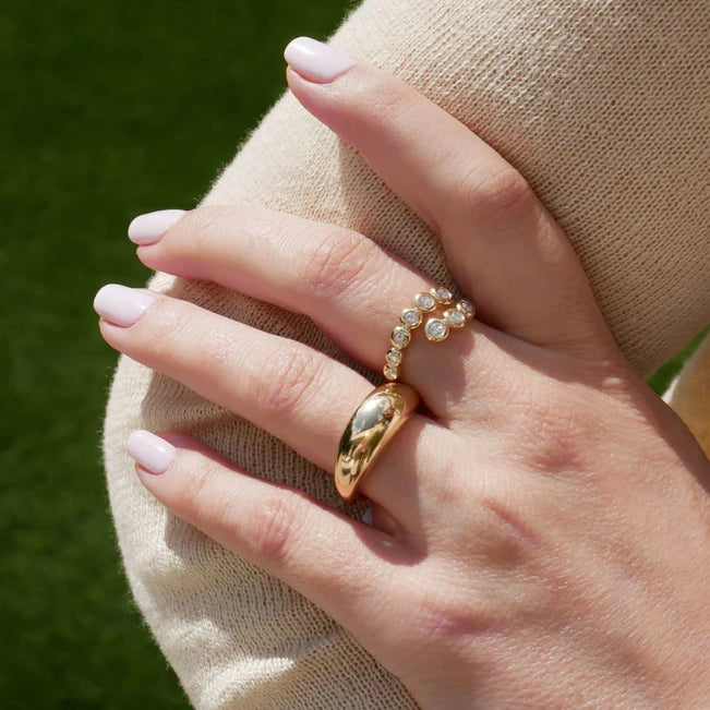 Close up of EF Collection Gold Jumbo Dome Ring in yellow gold on model’s finger