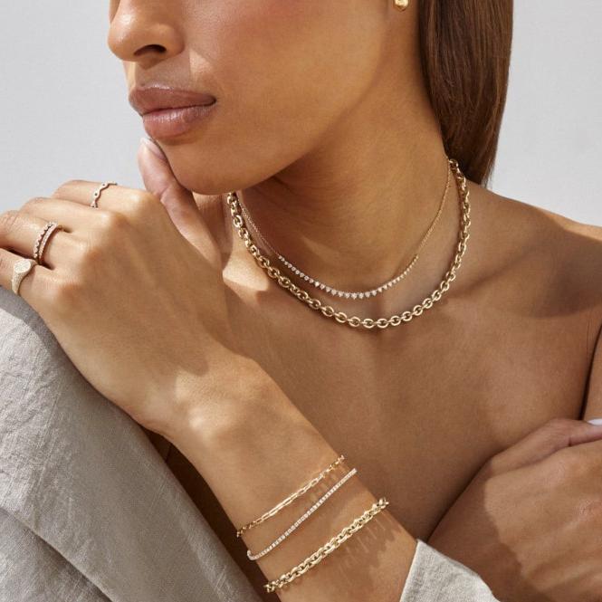 EF-Collection Graduated Diamond Necklace in yellow gold on models neck with chain necklace