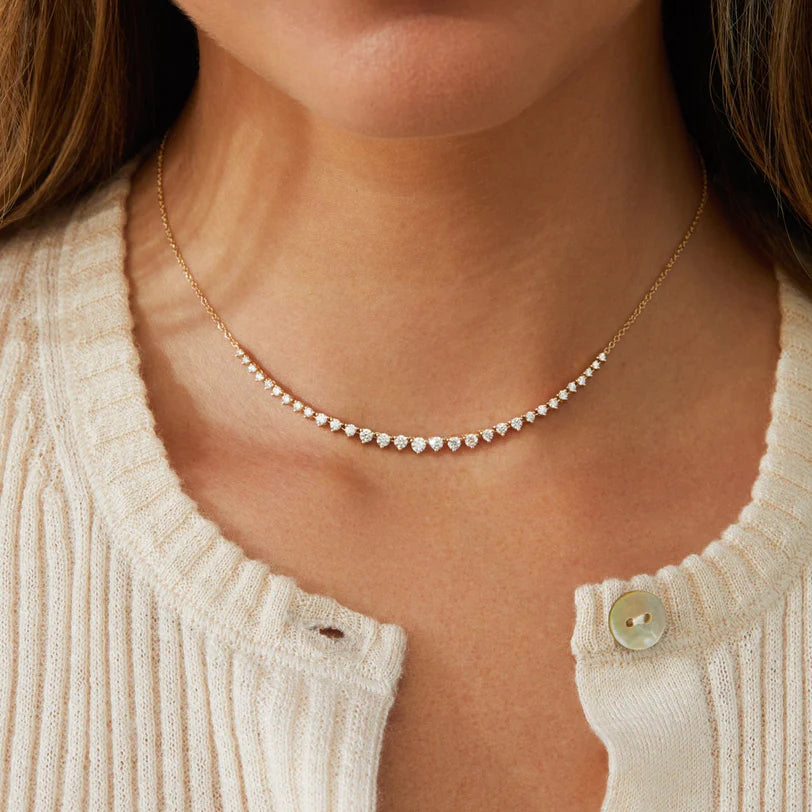Single EF-Collection Graduated Diamond Necklace in yellow gold styled on models neck