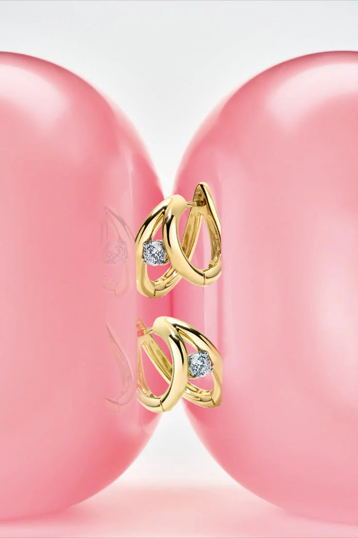 Rosario Navia Helium Diamond Hoops - Round Brilliant in yellow gold on white background with pink balloon