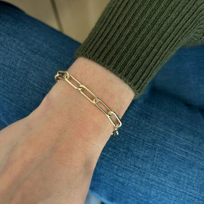 EF Collection Jumbo Lola Chain Bracelet in yellow gold styled on models wrist with jeans.