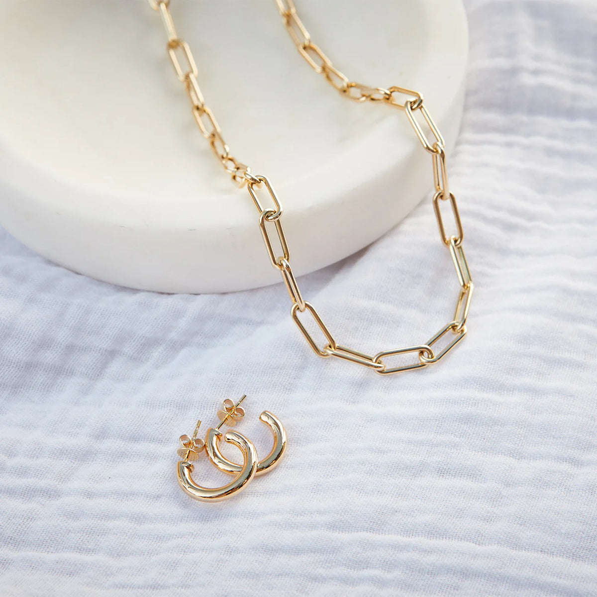 EF-Collection Jumbo Lola Chain Necklace in yellow gold on white background styled with gold jumbo hoop earrings