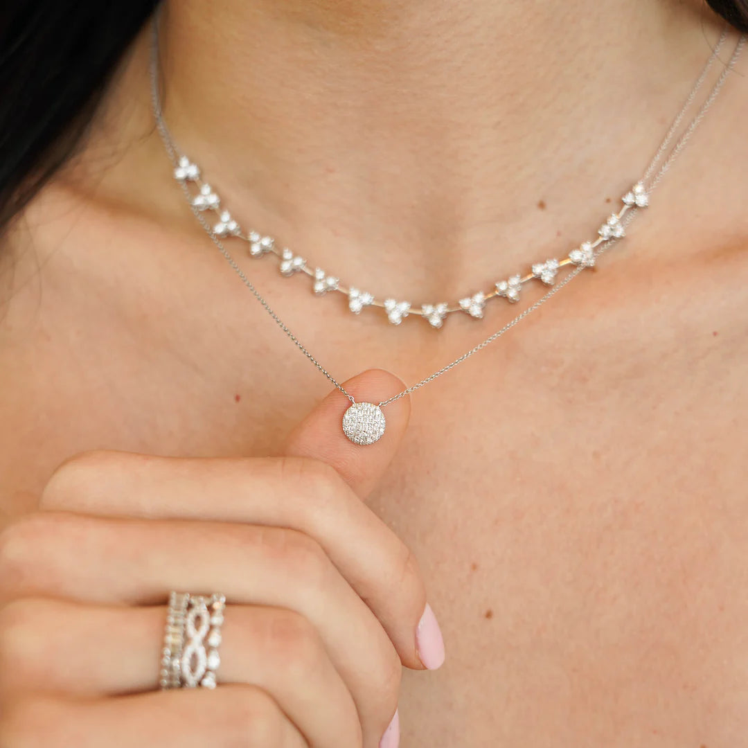 Close up of Dana Rebecca Designs Lauren Joy Medium Disc Necklace in white gold on models neck