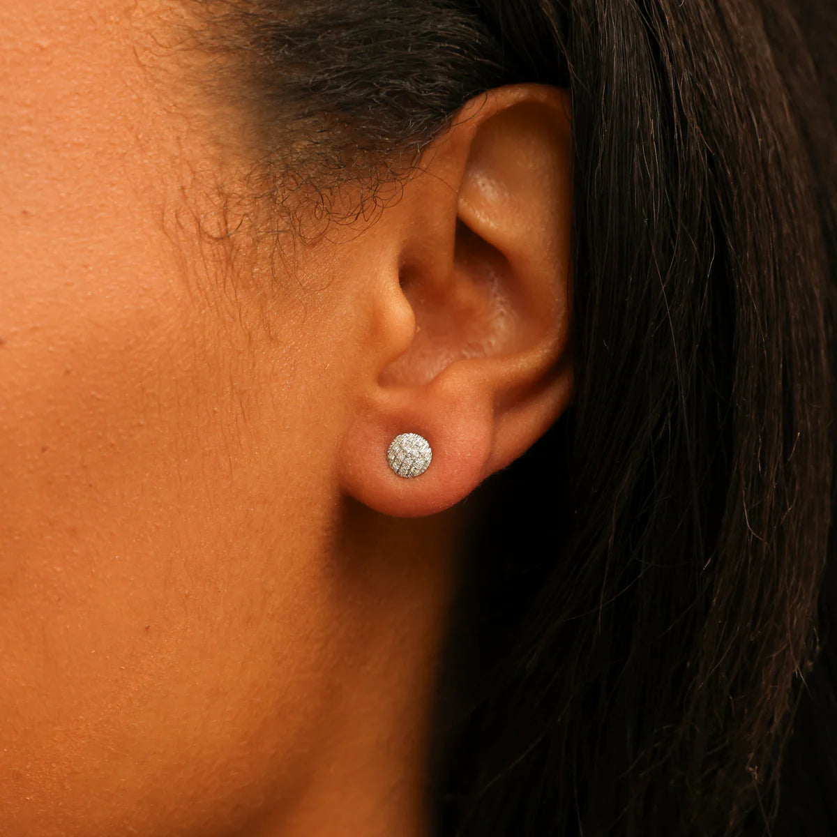 close up of Lauren Joy Mini Disc Studs in Yellow Gold styled on model's ear