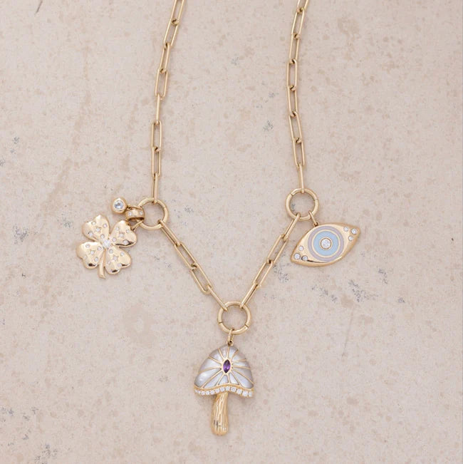 EF Collection Lola Triple Enhanced Chain Necklace with charms in yellow gold on marble background