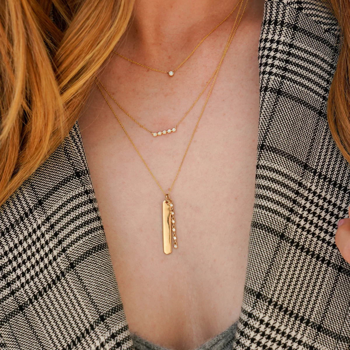 close up of model wearing Dana Rebecca Designs Lulu Jack Mini Bezel Bar Necklace in Yellow Gold